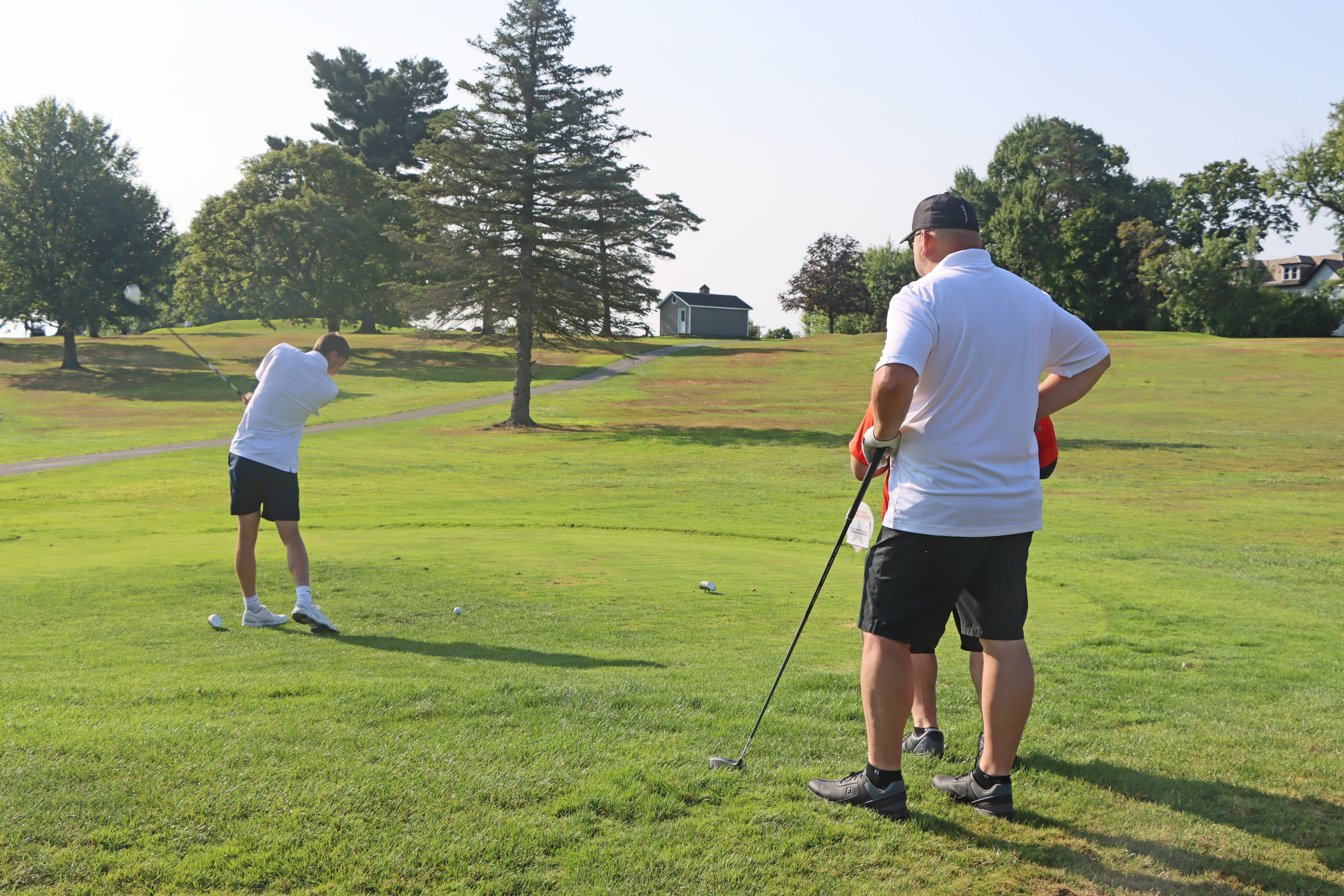 A gentlman teeing off